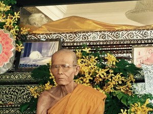 A venerable monk sits in front of the mummified body of a famed, centuries old holy monk (I sought advice before taking this picture to make sure it wouldn't be inappropriate)